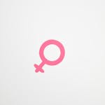 Minimalist illustration of a pink female gender symbol on a white background.